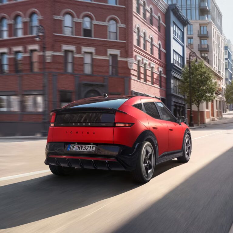 Hyundai_IONIQ_3_Exterior_3-4_Rear_Driving_1x1_1x1